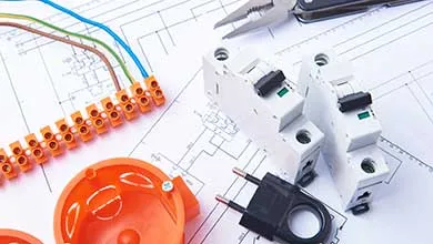 Electrical components: circuit breakers, a terminal block with colored wires, an orange electrical box, a plug, and pliers, all arranged on an electrical schematic.